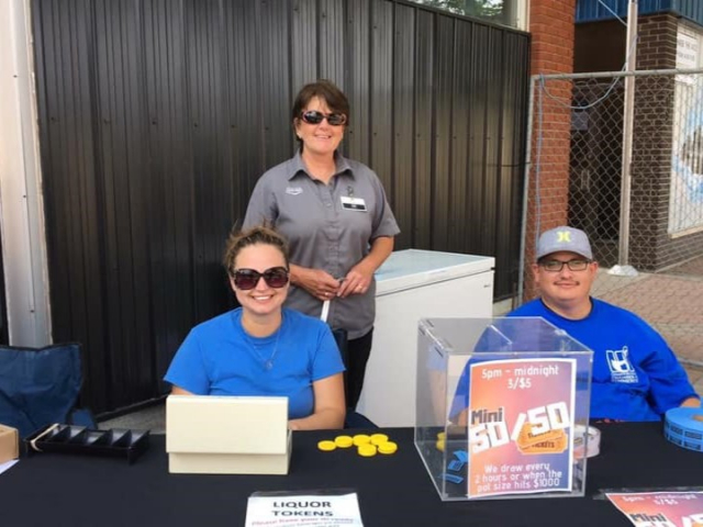 Midge Sametz Standing Behind Volunteers (Source: Facebook/Midge Sametz- Councillor for the RM of Dauphin)